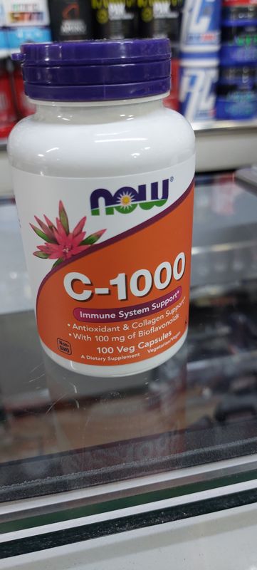 Банка NOW Foods C-1000, 100 растительных капсул, на стеклянной витрине