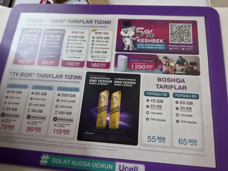 Настольный коврик-плакат Ucell с тарифами «BOR», «TV BOR», «Foydali», суперакцией «5G роутер + интернет на год» и кэшбэком 5% в приложении