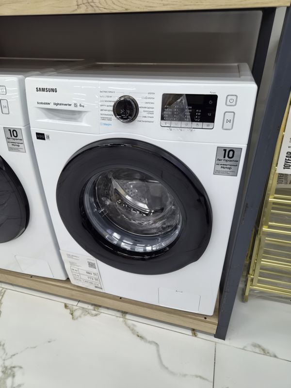 Стиральная машина Samsung WW80AGAS28AELD, 8 кг, белая, на полке в зале